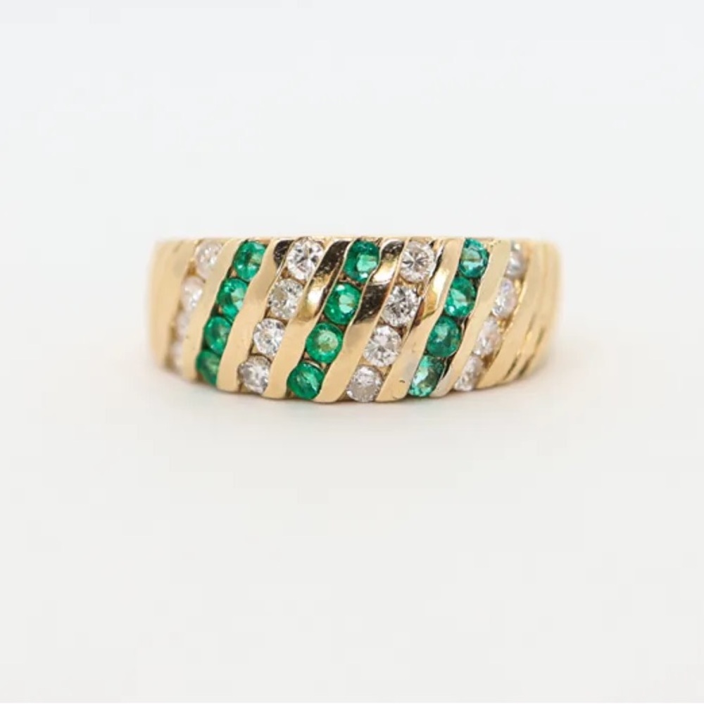 emerald and white diamond twist ring with yellow gold wide band